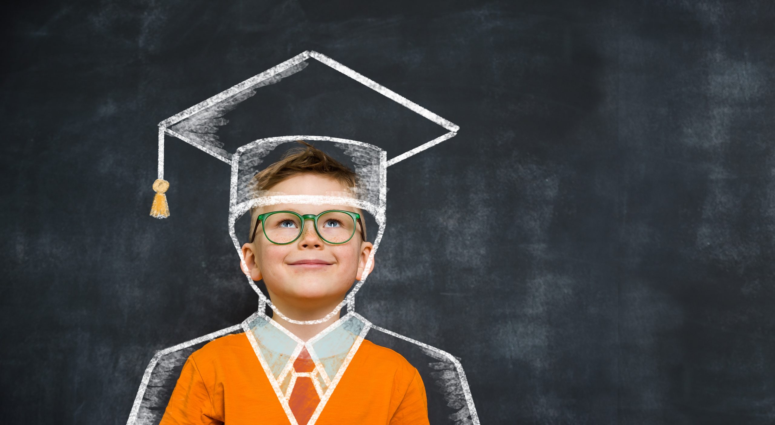 HappyChildInEducationCapAgainstChalkboardSchoolBoyIn Happy Child In Education