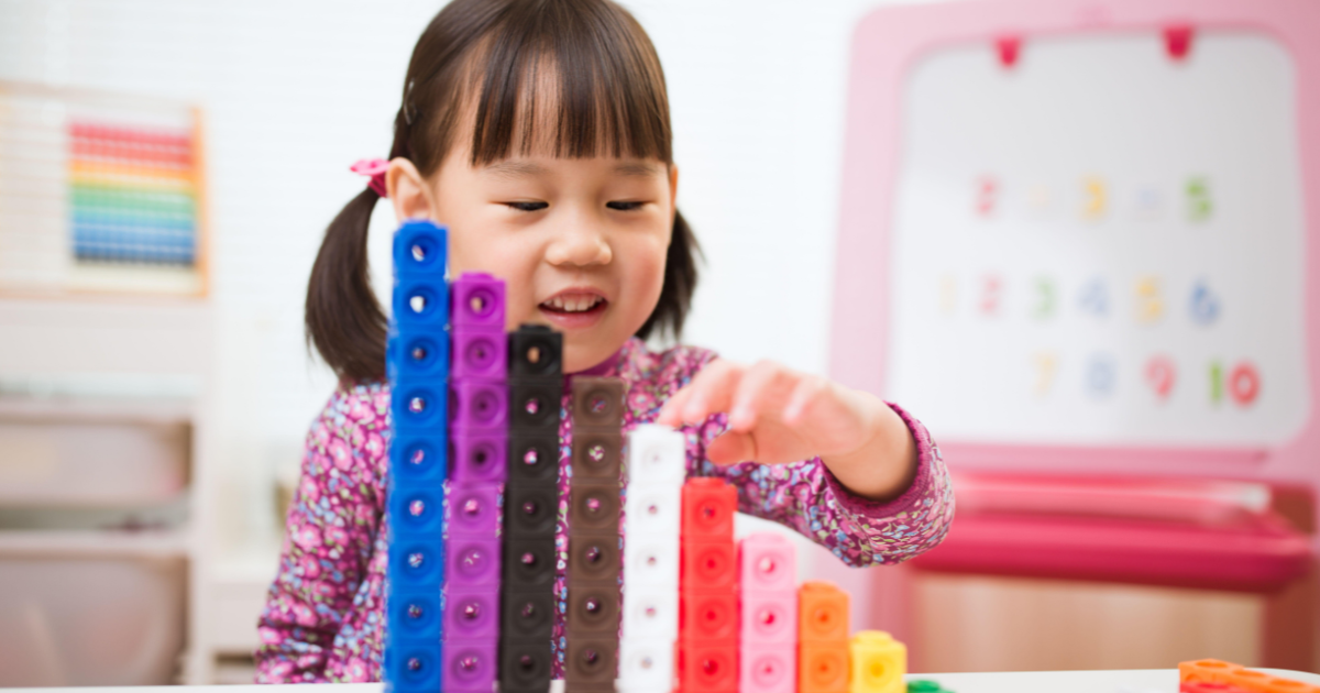 little girl playing preschool games for early learning